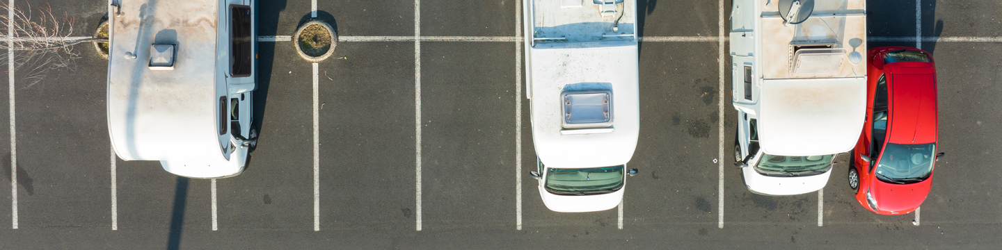 Campervans parked in a car parking.