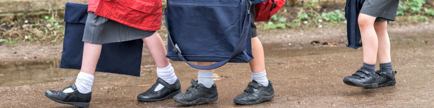 Young children walking to school.