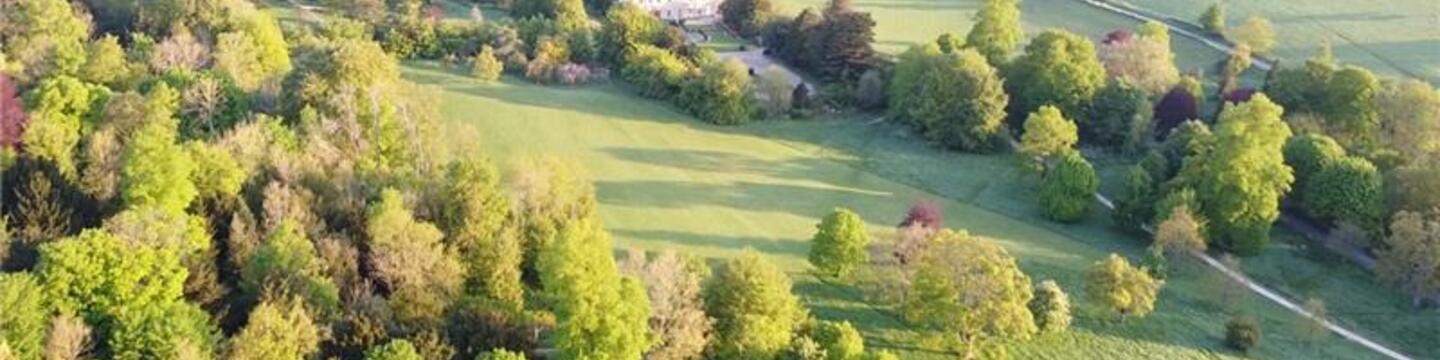 Aerial image of Stanmer Estate on a bright, sunny day