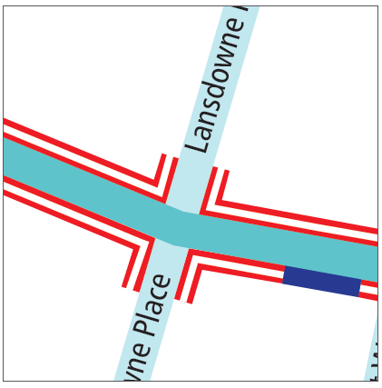 An image of a four way junction showing the double red lines extending into side roads